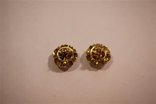 A pair of gold, ruby and diamond flowerhead earrings.